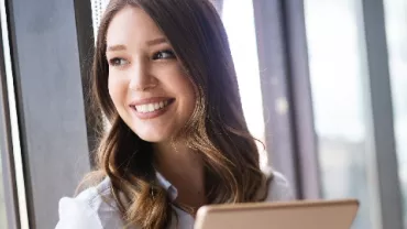 girl smiling with laptop